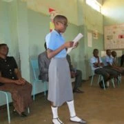 A learner reads a poem for the SDC delegation